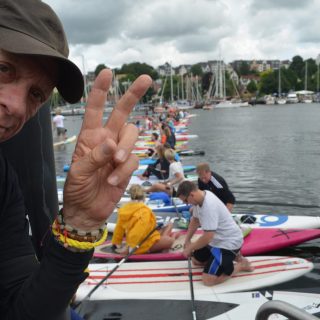 Ric O'Barry successfully crosses Flensburg harbor via 200 standup paddle boards to bring awareness to Taiji dolphin slaughter