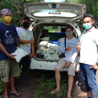 Our team helps to distribute masks and food to local villagers in need, Bali, Indonesia